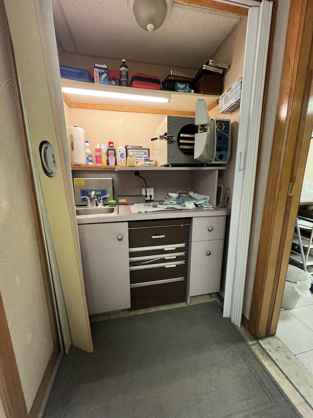 storage room featuring a sink