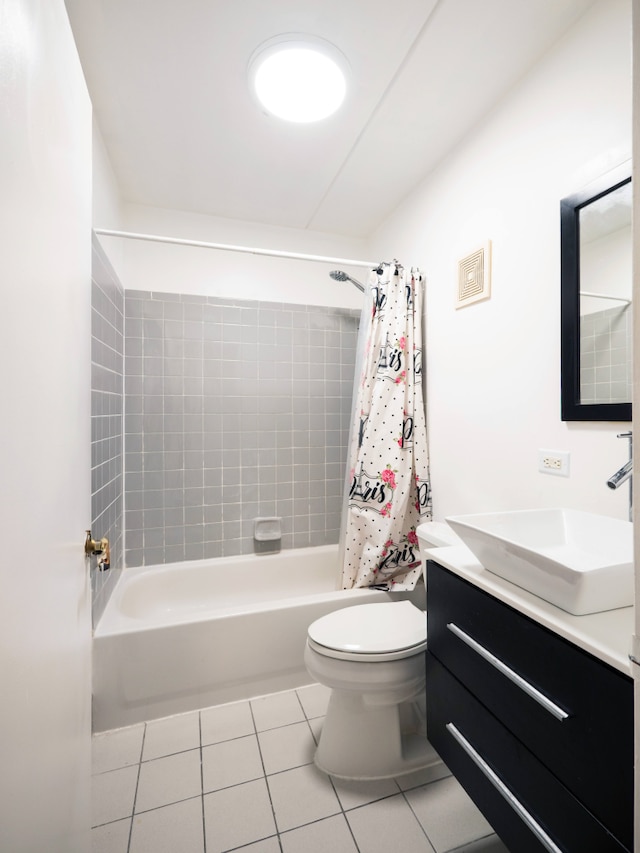 bathroom featuring visible vents, vanity, shower / bath combination with curtain, toilet, and tile patterned floors