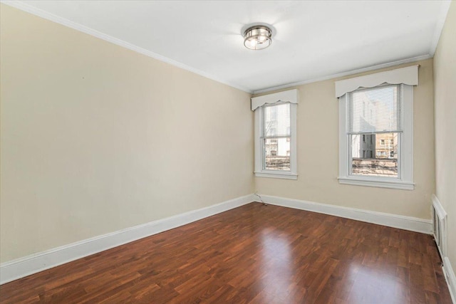 unfurnished room with baseboards, dark wood-style floors, and ornamental molding