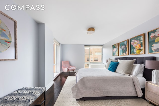 201 E 80th St Unit 17C, New York City, NY 10075 - bedroom with wood finished floors and baseboards