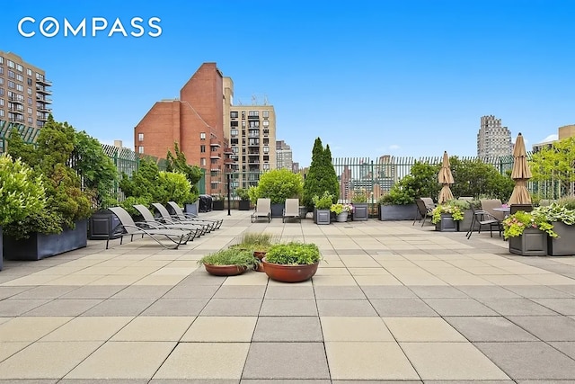 exterior space featuring fence and a city view