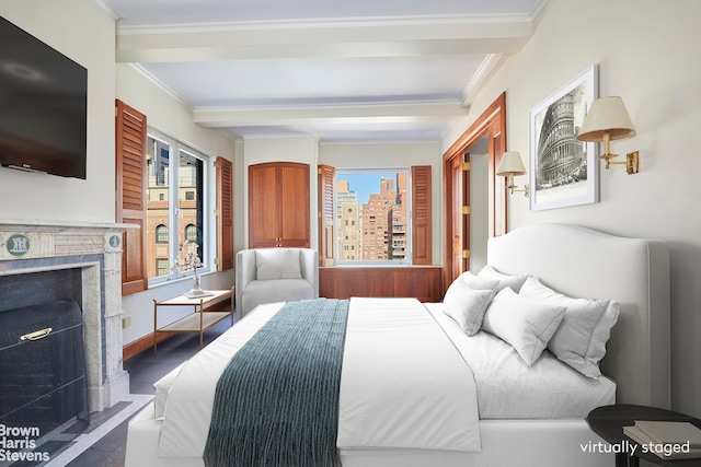 bedroom with ornamental molding, wood finished floors, a fireplace, and beamed ceiling