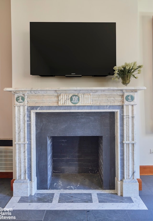 details featuring a high end fireplace