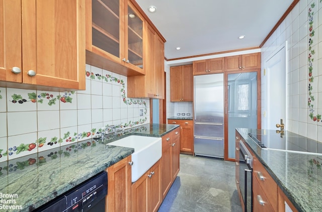 kitchen featuring a sink, glass insert cabinets, black appliances, and brown cabinets