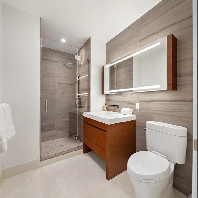 full bath featuring vanity, tile patterned flooring, toilet, recessed lighting, and a shower stall