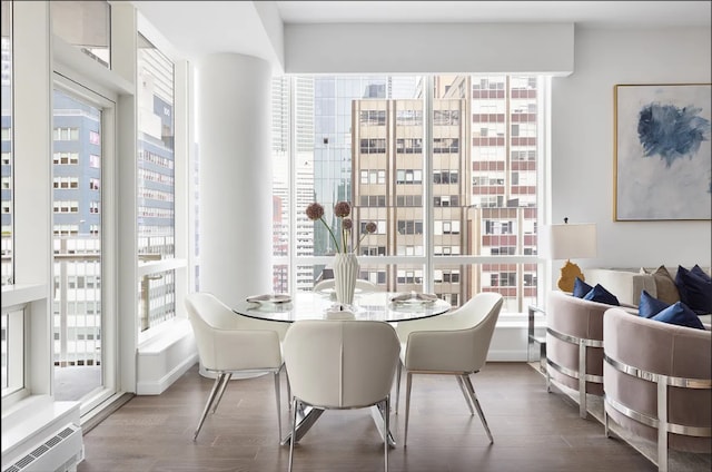 dining space with dark wood-type flooring