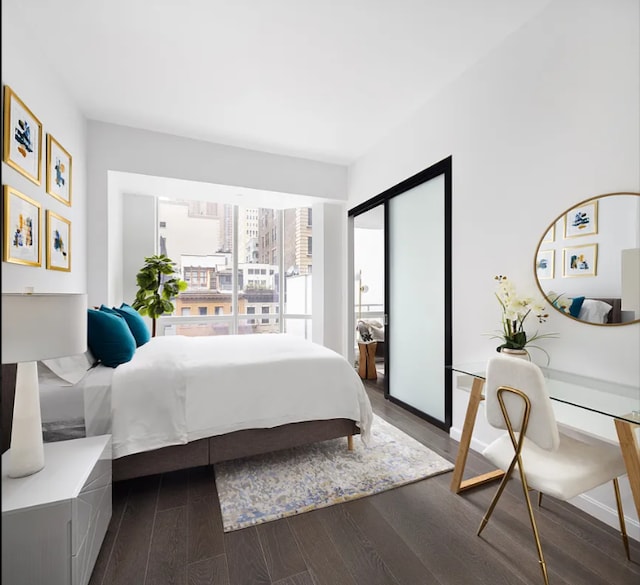 bedroom with dark wood-type flooring