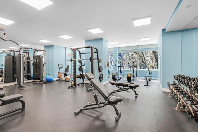 exercise room with baseboards