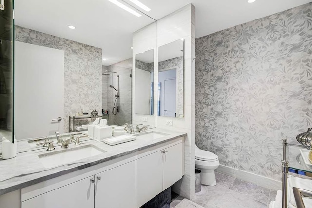 full bathroom featuring a sink, baseboards, a tile shower, and recessed lighting