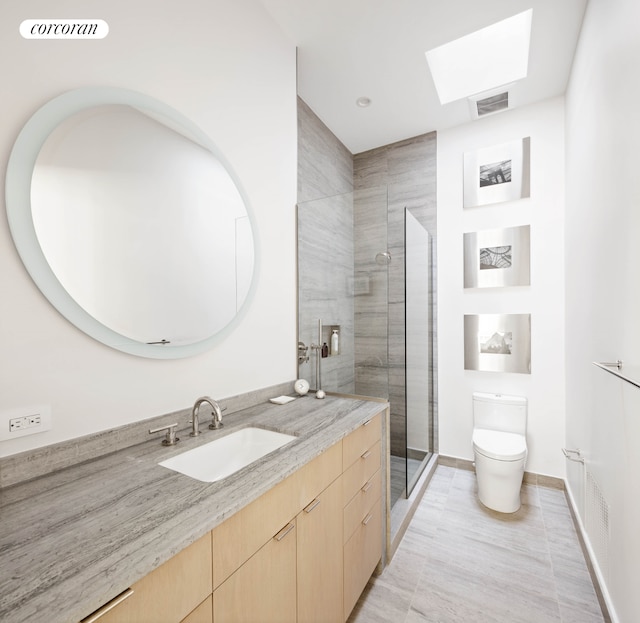 bathroom with visible vents, a skylight, a shower stall, vanity, and toilet