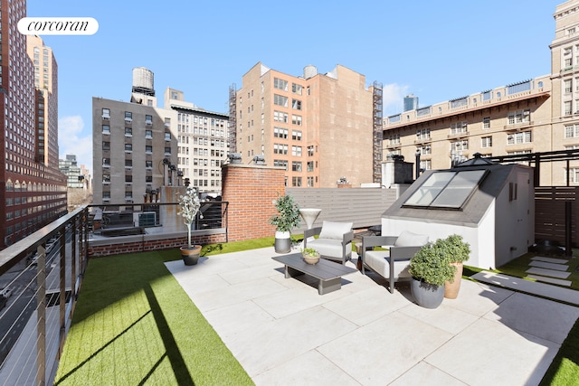 view of patio featuring a city view and a balcony