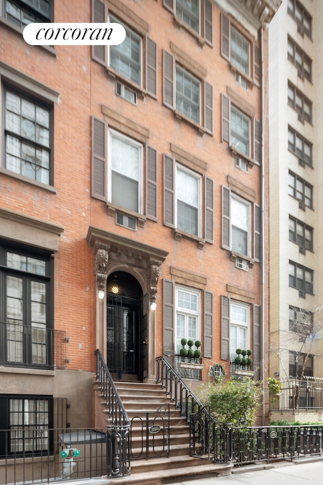 view of building exterior with a fenced front yard