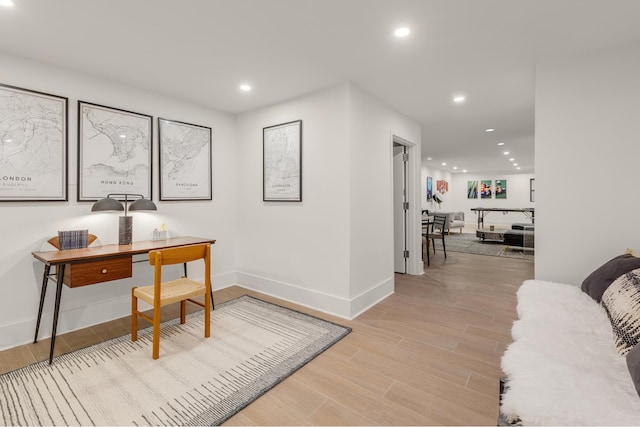office area with recessed lighting, baseboards, and light wood finished floors
