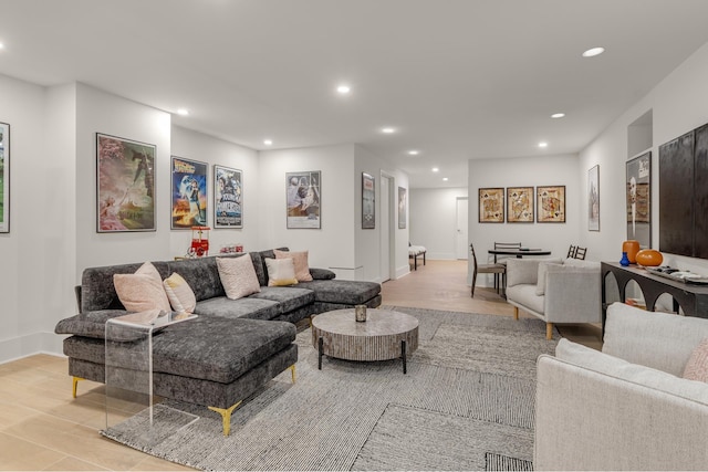 living area with recessed lighting and baseboards