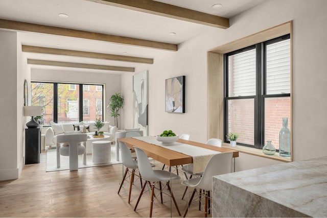 dining area featuring beamed ceiling, recessed lighting, and wood finished floors