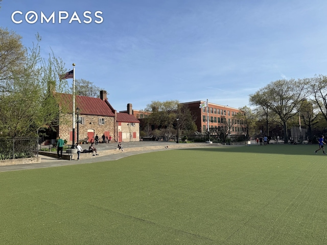view of property's community featuring fence