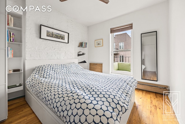 bedroom featuring a ceiling fan and wood finished floors