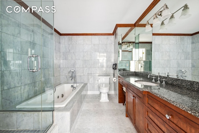 full bathroom with crown molding, vanity, toilet, tile walls, and a tub with jets