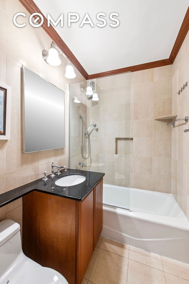 155 W 68th St Unit 404, New York City, NY 10023 - bathroom featuring tile walls, vanity, toilet, tile patterned flooring, and enclosed tub / shower combo