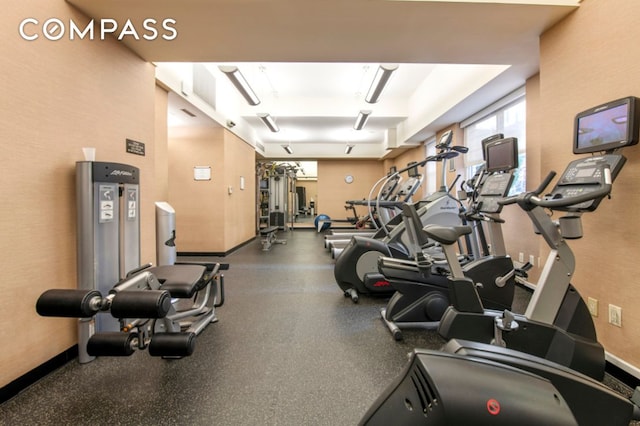 exercise room with baseboards