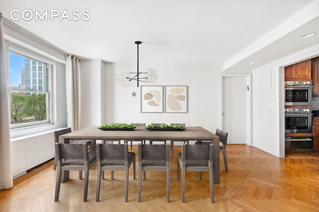 dining area featuring an inviting chandelier