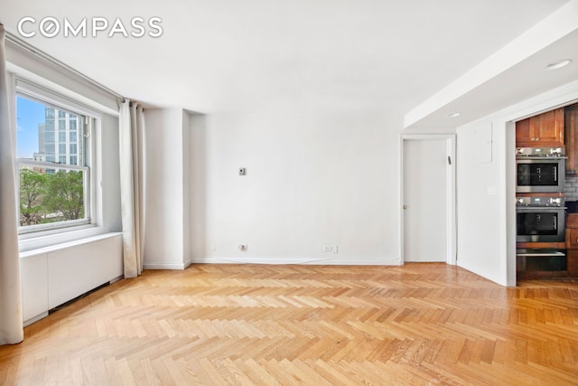 empty room with baseboards