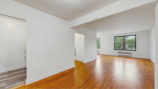 3500 Snyder Ave Unit 3P, New York City, NY 11203 - empty room featuring radiator, wood finished floors, baseboards, and a smoke detector