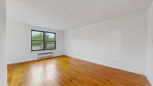 3500 Snyder Ave Unit 3P, New York City, NY 11203 - empty room with radiator heating unit, hardwood / wood-style floors, and baseboards