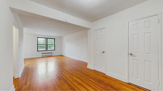 3500 Snyder Ave Unit 3P, New York City, NY 11203 - unfurnished room featuring radiator, wood finished floors, and baseboards