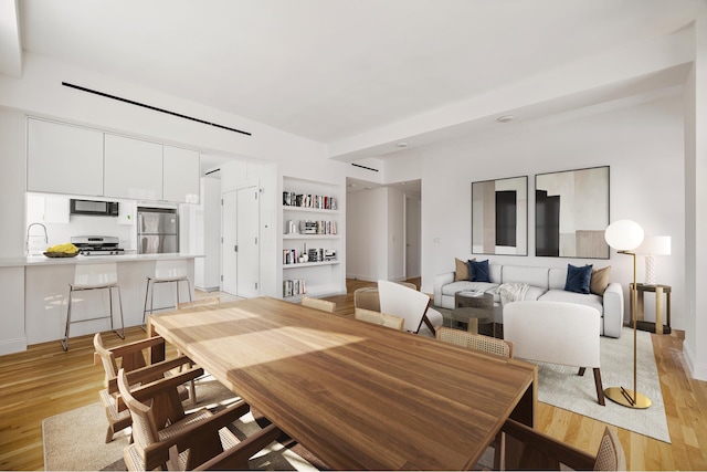 11 E 68th St Unit 7Ce, New York City, NY 10021 - dining area with light wood-type flooring