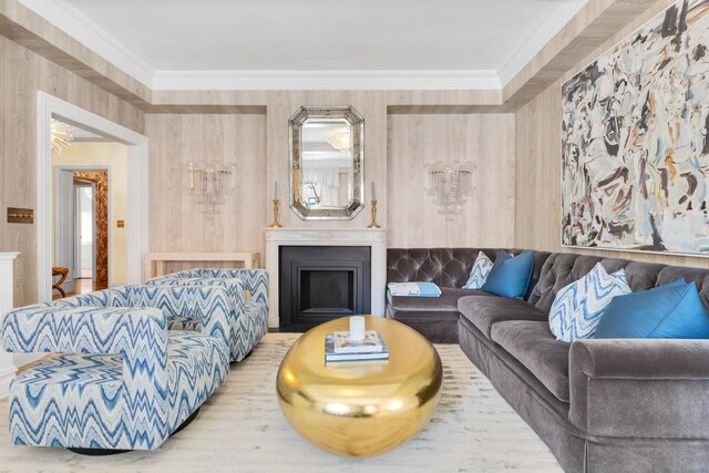 1133 Park Ave Unit 2W, New York City, NY 10128 - living area featuring crown molding, wood finished floors, and a fireplace