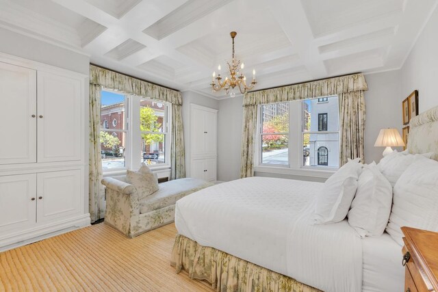 1133 Park Ave Unit 2W, New York City, NY 10128 - bedroom featuring an inviting chandelier, coffered ceiling, and beam ceiling