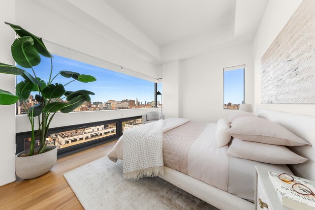123 3rd Ave Unit Ph18, New York City, NY 10003 - bedroom featuring wood finished floors and a view of city