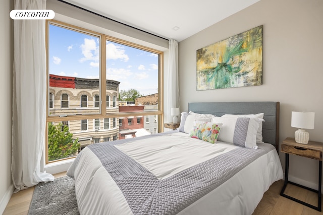 68 Eldert St Unit 3B, New York City, NY 11207 - bedroom featuring multiple windows and wood finished floors
