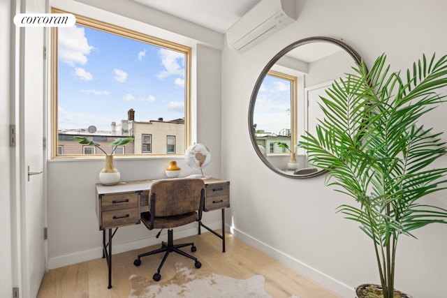 68 Eldert St Unit 3B, New York City, NY 11207 - office with an AC wall unit, wood finished floors, and baseboards