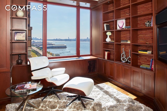 220 Riverside Blvd Unit 19Jg, New York City, NY 10069 - living area featuring a water view, wood finished floors, and built in features