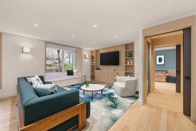 20 River Ter Unit 11L, New York City, NY 10282 - living area with light wood-style floors, baseboards, recessed lighting, and built in features