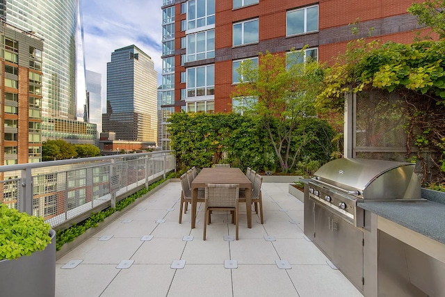 20 River Ter Unit 11L, New York City, NY 10282 - view of patio / terrace featuring outdoor dining area and a city view