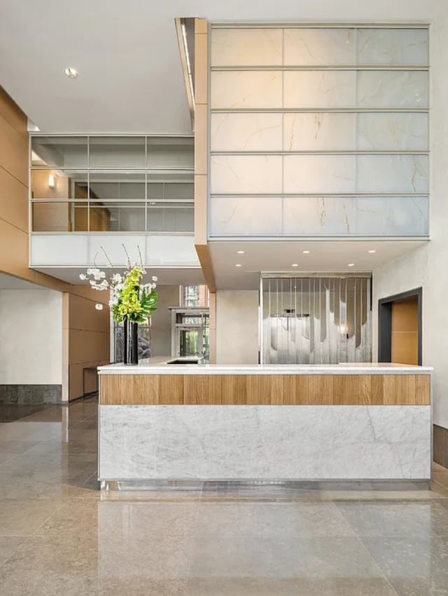 20 River Ter Unit 11L, New York City, NY 10282 - reception area with a high ceiling and recessed lighting