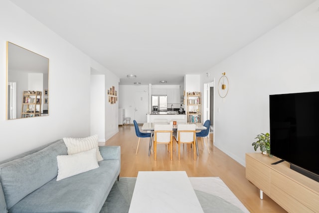 20 River Ter Unit 11L, New York City, NY 10282 - living room with light wood-type flooring and baseboards