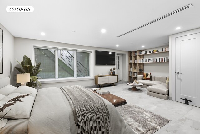 bedroom featuring recessed lighting and marble finish flooring