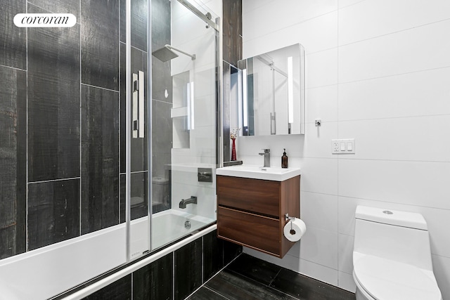 519 Maple St Unit 1B, New York City, NY 11225 - bathroom featuring tiled shower / bath combo, vanity, tile walls, and tile patterned floors