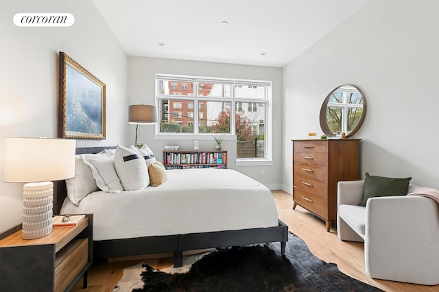 519 Maple St Unit 1B, New York City, NY 11225 - bedroom with multiple windows and light wood finished floors