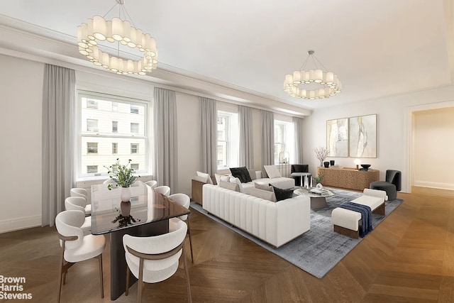 living area with baseboards and a notable chandelier