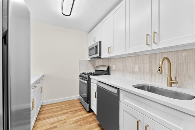 2108 Dean St, New York City, NY 11233 - kitchen with dishwashing machine, stainless steel microwave, gas range, a sink, and backsplash