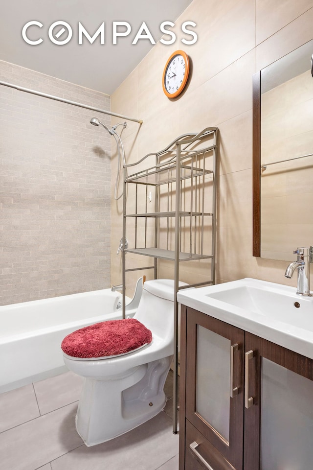 bathroom featuring vanity, shower / bathing tub combination, tile patterned floors, and toilet