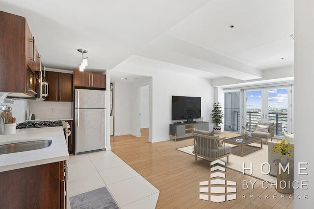 302 2nd St Unit 12H, New York City, NY 11215 - living room with baseboards and light wood finished floors