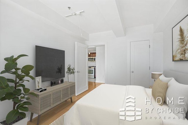 302 2nd St Unit 12H, New York City, NY 11215 - bedroom with wood finished floors and beamed ceiling