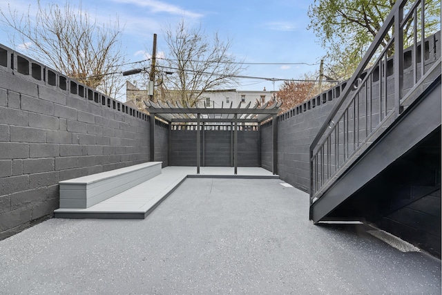 view of patio / terrace featuring a fenced backyard and a pergola