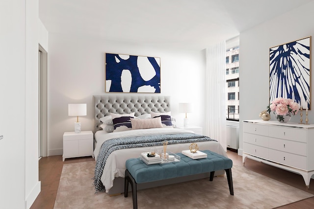 bedroom with baseboards and light wood-type flooring